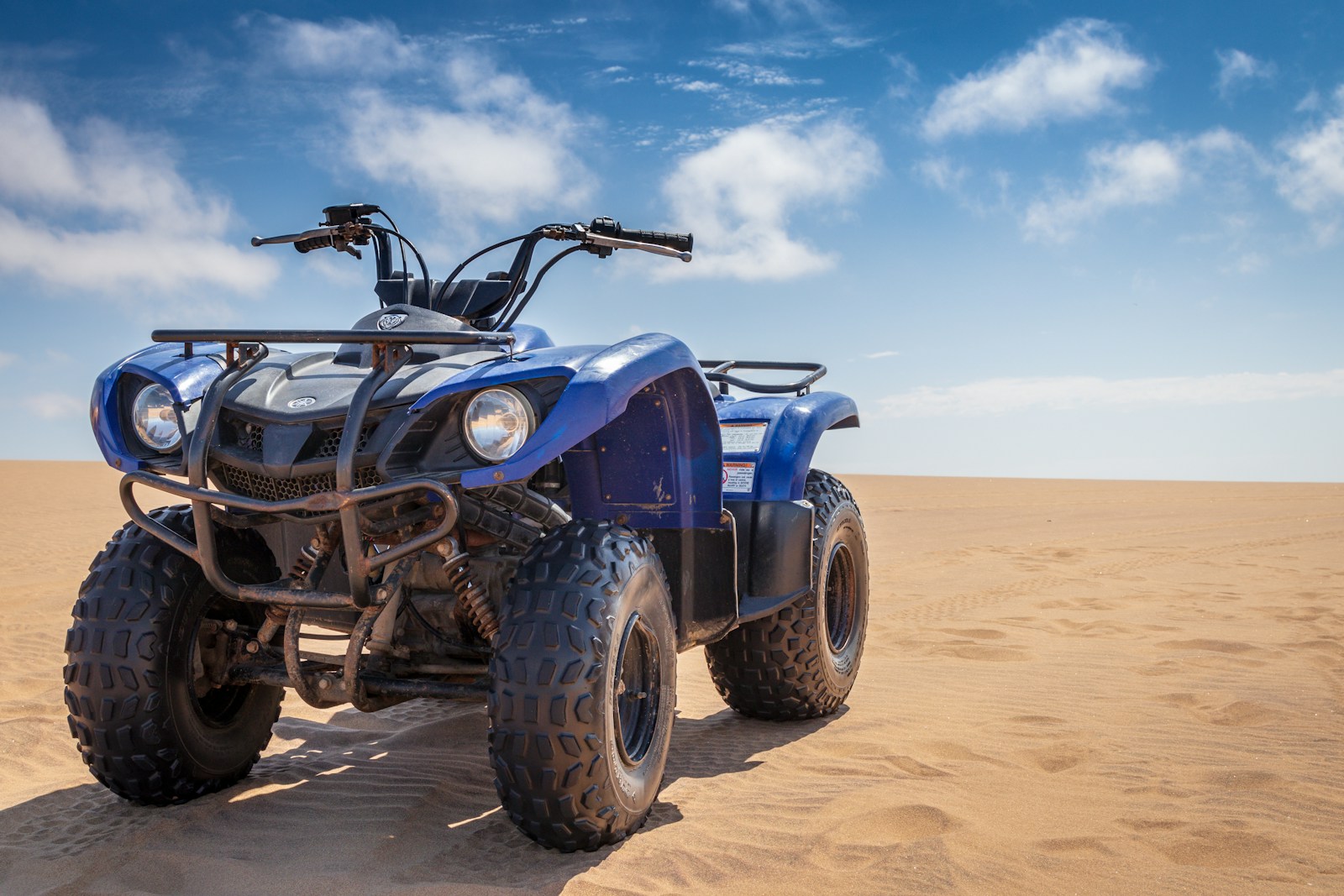 blue ATV on desert power toys